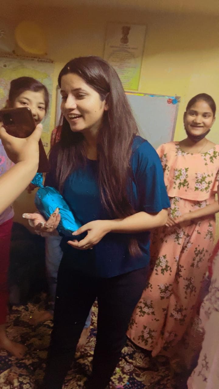 Tanuja Singh with students at a class celebration